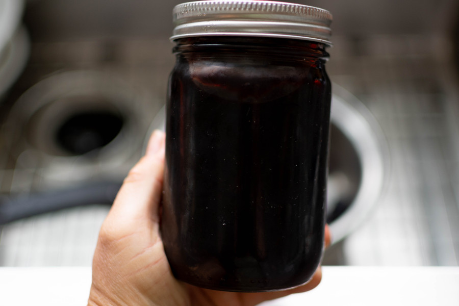 elderberry syrup jar hand